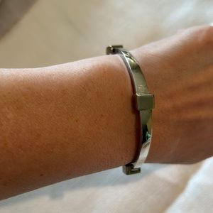 Oval Silver Tone Bangle with Rectangle Studs